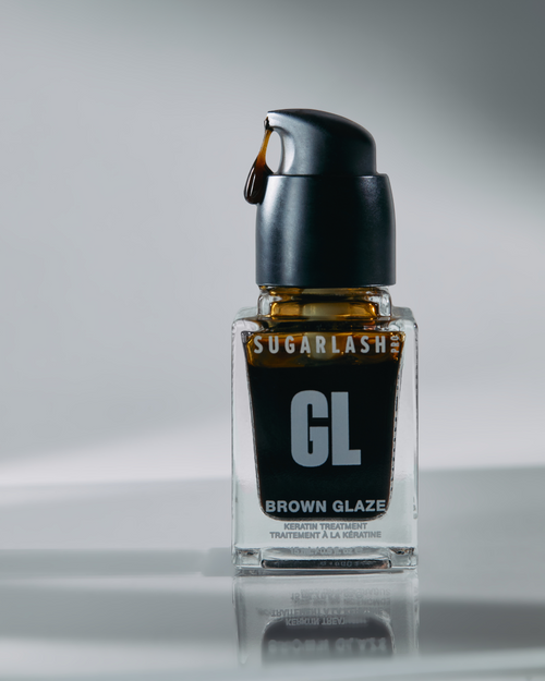 Brown Glaze bottle with product coming out of pump, treatment for eyelash extensions