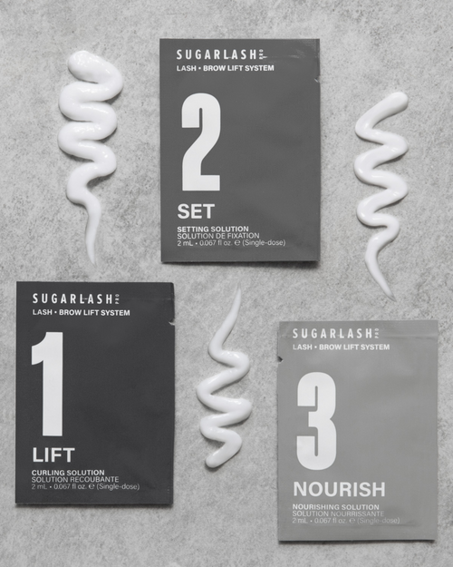 Lift, Set, and Nourish Lash and Brow Lamination Sachets next to their product texture.