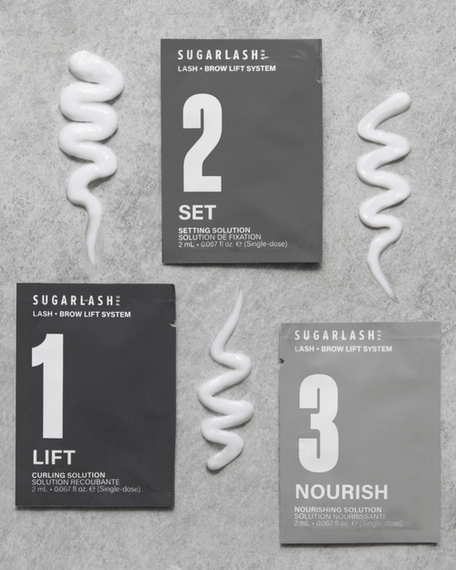 Lift, Set, and Nourish Lash and Eyebrow Lamination Sachets next to their product texture.