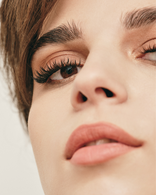 Close up of a model wearing volume eyelash extensions.