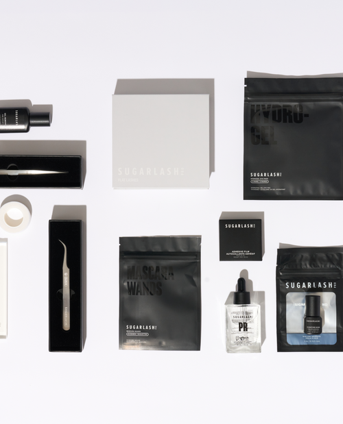 image of mini lash lift kit with tweezers, gel remover, pads, mascara wands, lash glue