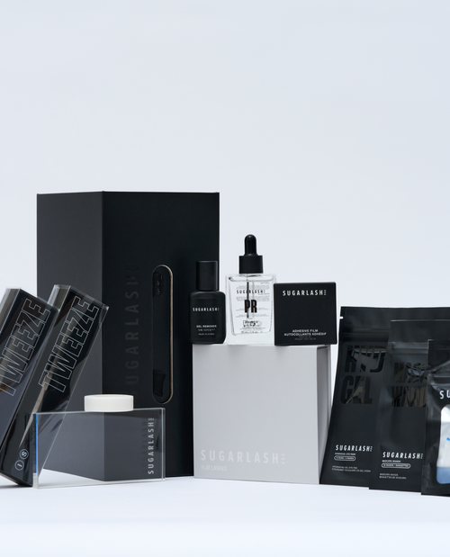 image of mini lash lift kit with tweezers, gel remover, pads, mascara wands, lash glue