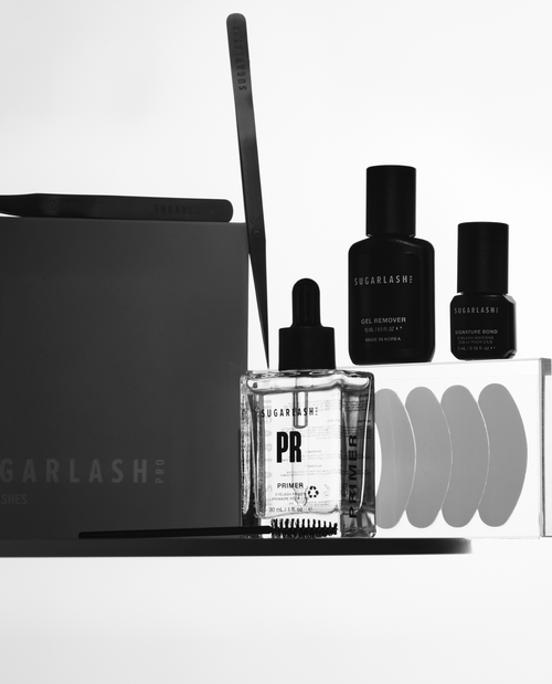 Mini eyelash extension kit of lash tweezers, wants, serum, gel remover, eye pads,