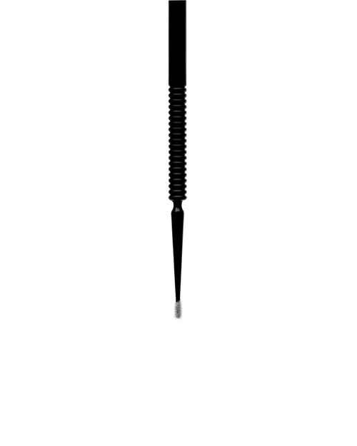 Close up of Micro Brush for eyelash extensions and brow services.
