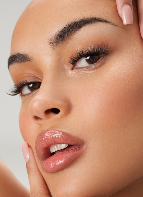 A model with the Kat Eye Starter Kit temporary lash extensions applied.