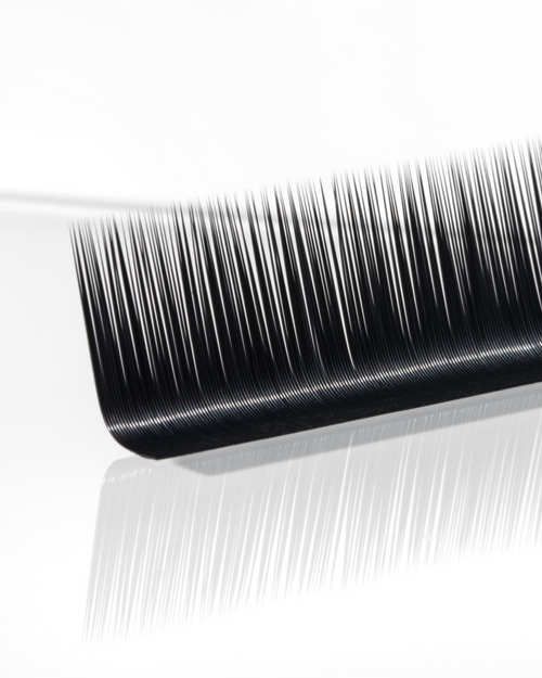 A strip of Flat lashes on a white background.