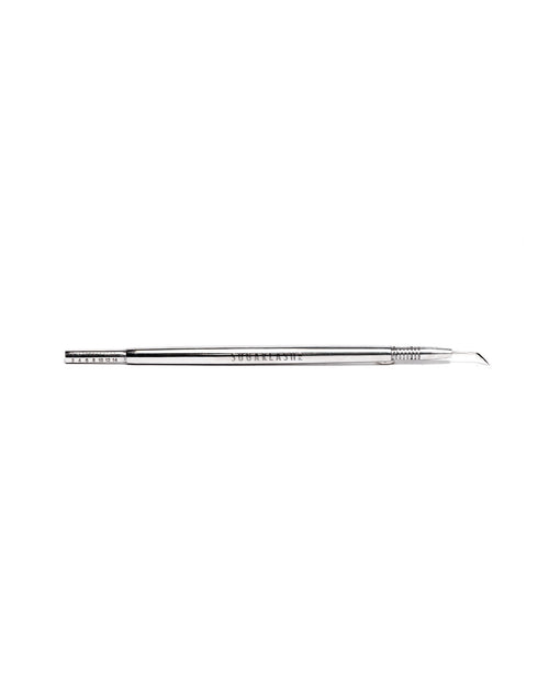 Eyelash extension Lash Pick laid horizontally on a white background.